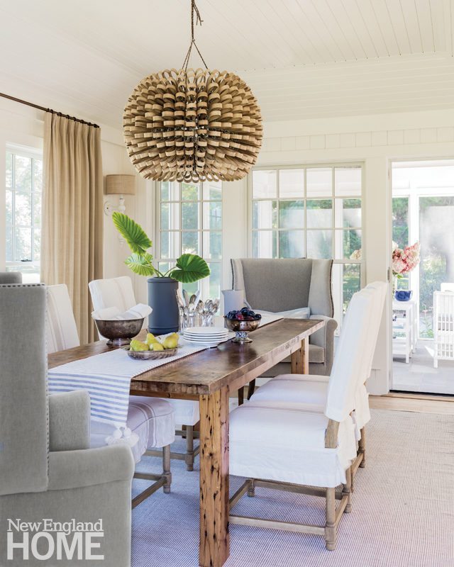 Timeless Nautical Style On Cape Cod New England Home The Dining Room S Velvet Covered Wing Chairs Provide A Luxe Counterpoint To Vintage Violin Maker Table And Textural Pendant Light