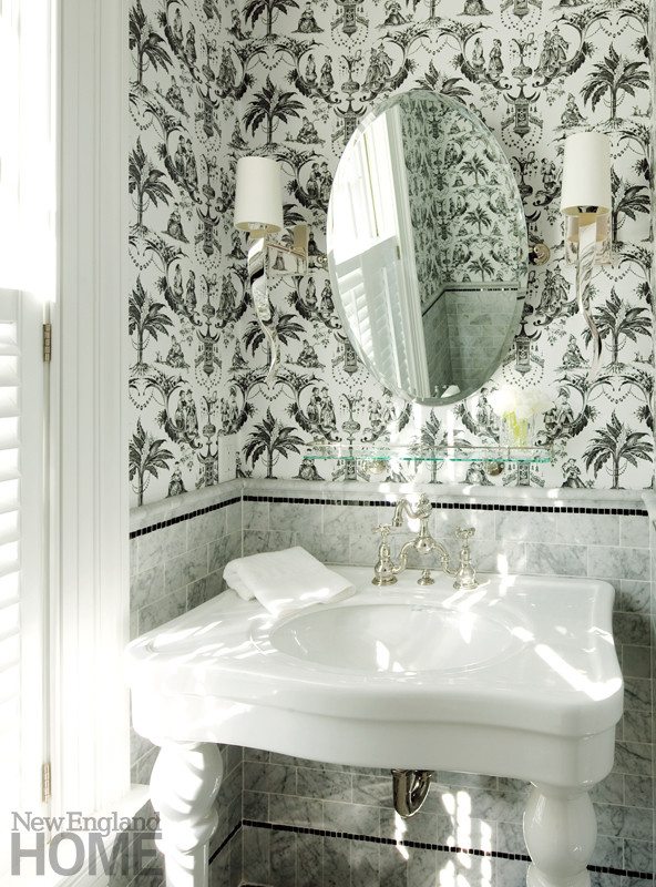 A black-and-white palette streamlines the compact powder room.