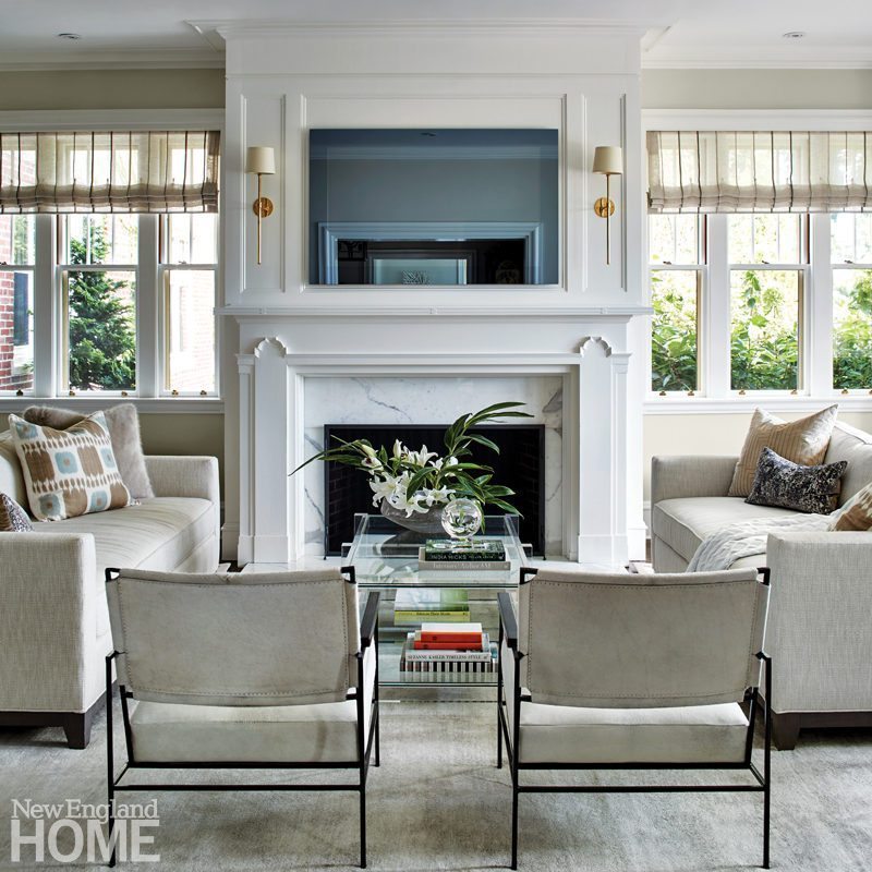 A Tudor Style Home Gets Fresh Look New England A Seating Area In The Living Room Is Brightened And Lightened With Hide Upholstered Chairs Glass Topped Acrylic Table Deep Keegan Sofas Are From