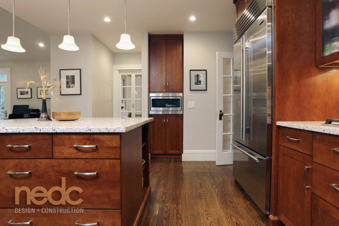5 Hot Kitchen Trends And 3 That Are On Their Way Out New England Quartz Countertops Help To Brighten A Kitchen With Dark Wood Cabinetry