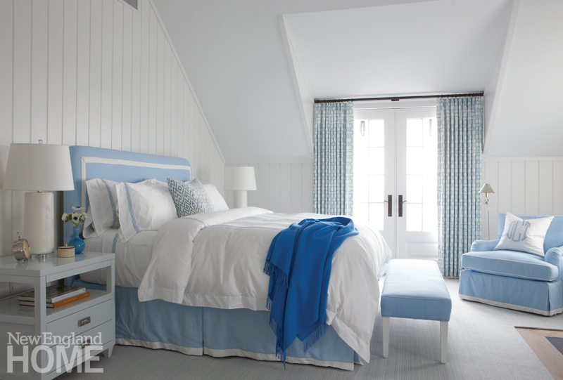 Galleries New England Home Magazine In The Master Bedroom A Tailored Roach Lends Structure To Powder Blue Easy Chair Custom Headboard And Bed Skirt French Doors Swing Open For