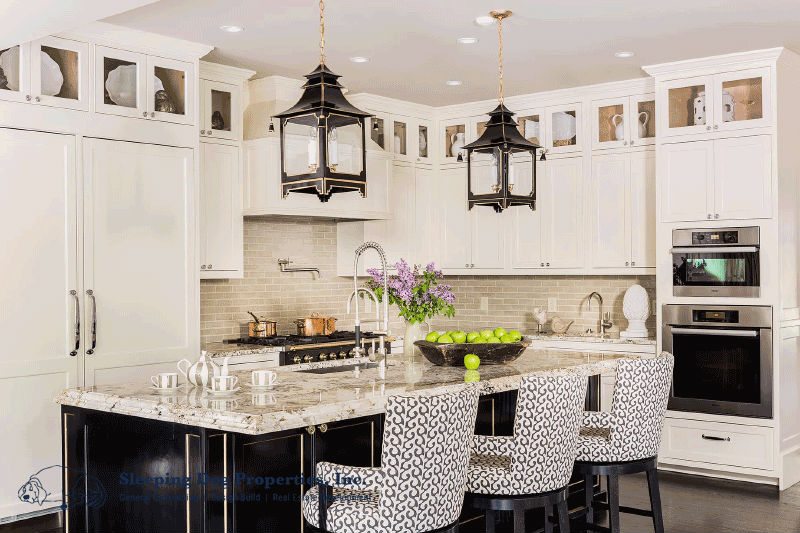 Farmhouse kitchen with black and white cabinetry