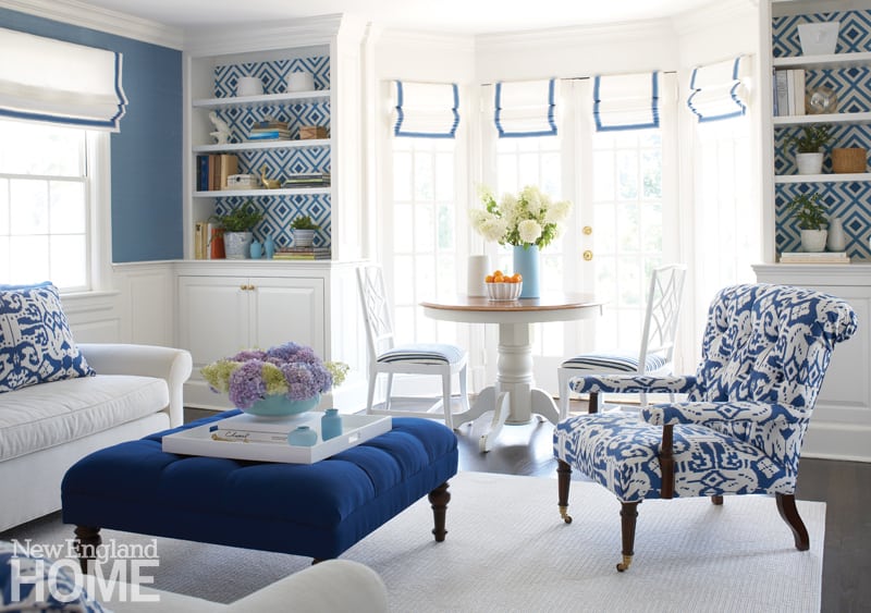Galleries New England Home Magazine Comfort Was Paramount In The Family Room Which Features A Custom Ottoman Covered Outdoor Canvas Patterned Paper Enlivens Back Of Bookshelves