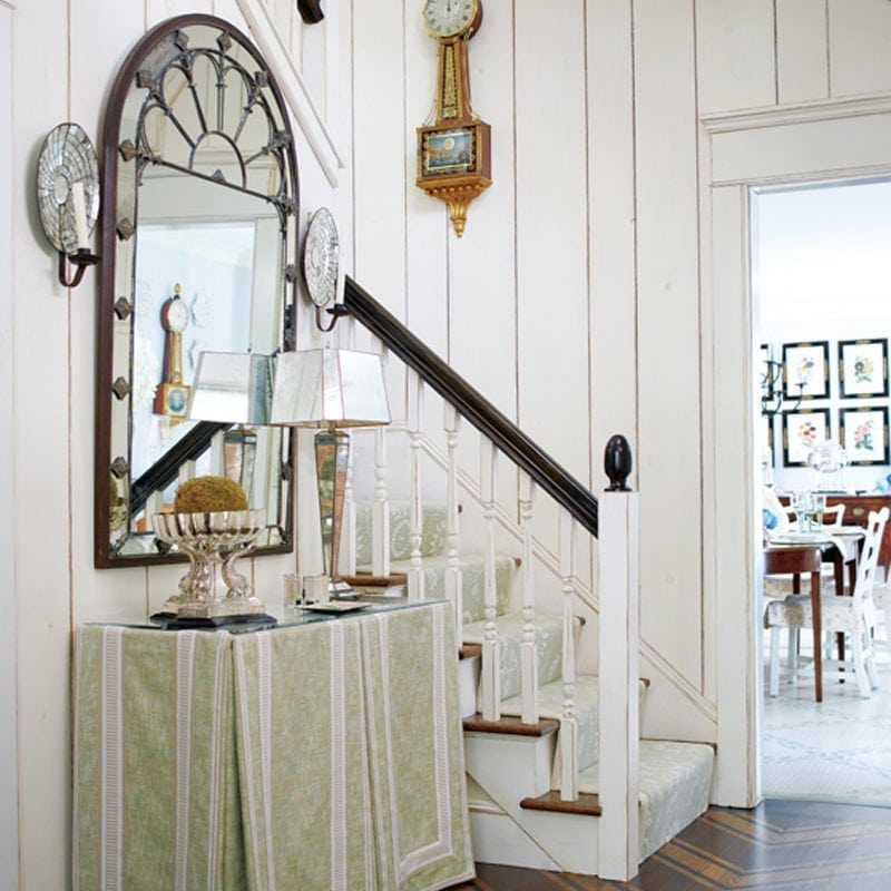 Classic On Cape Cod New England Home The Owners Covered Entry S Original Brick Wall With Meticulously Painted And Glazed Woodwork Light Wood A Big Mirror Make Small Space Appear