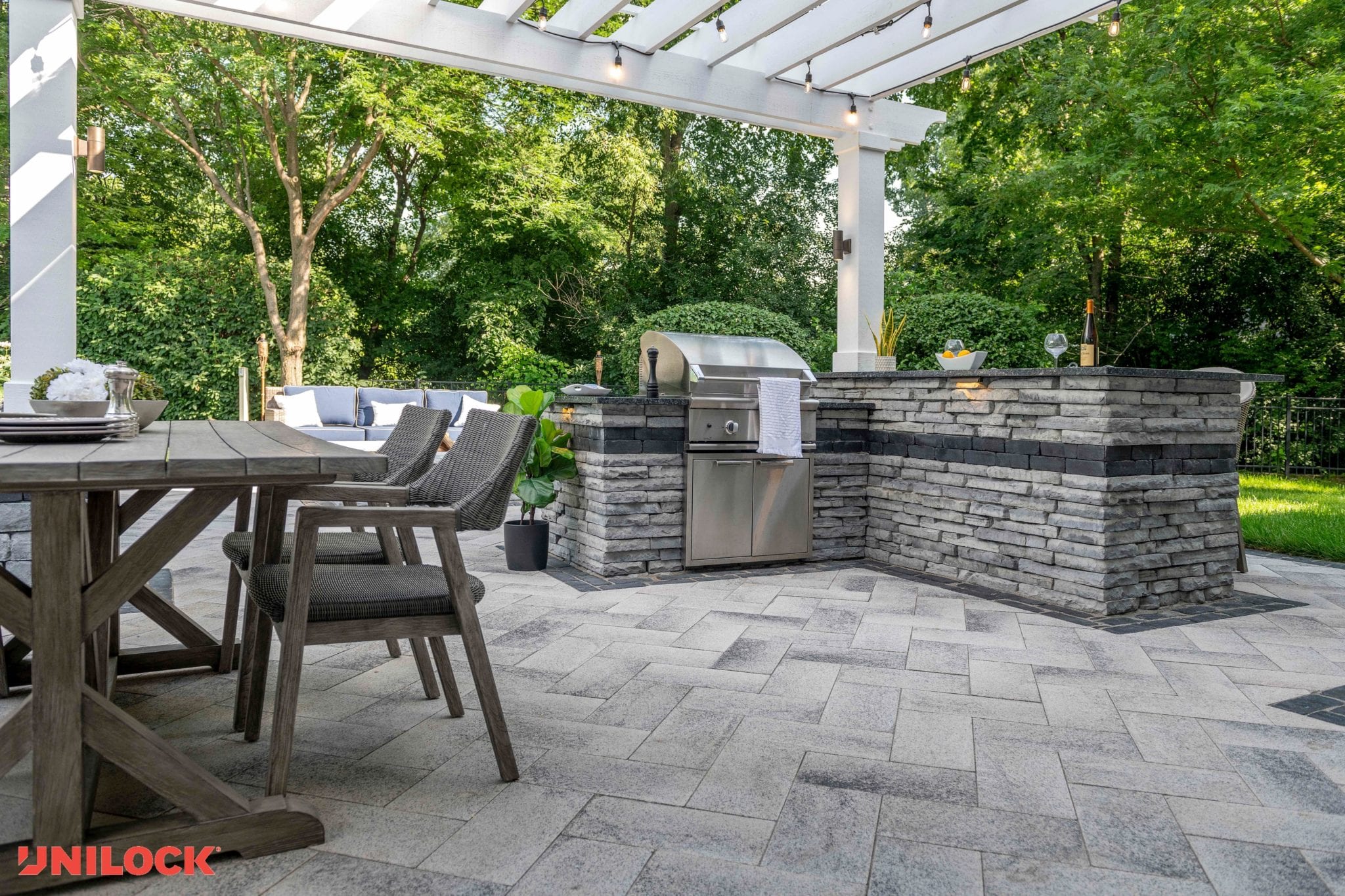 Gourmet outdoor kitchen with gray stone work 