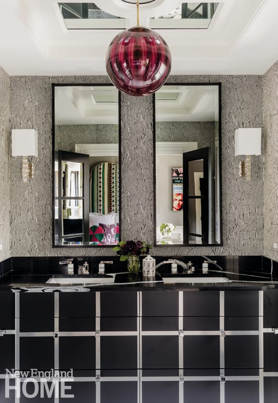Bathroom featuring black-and-stainless steel vanity designed by Justin Van Breeda